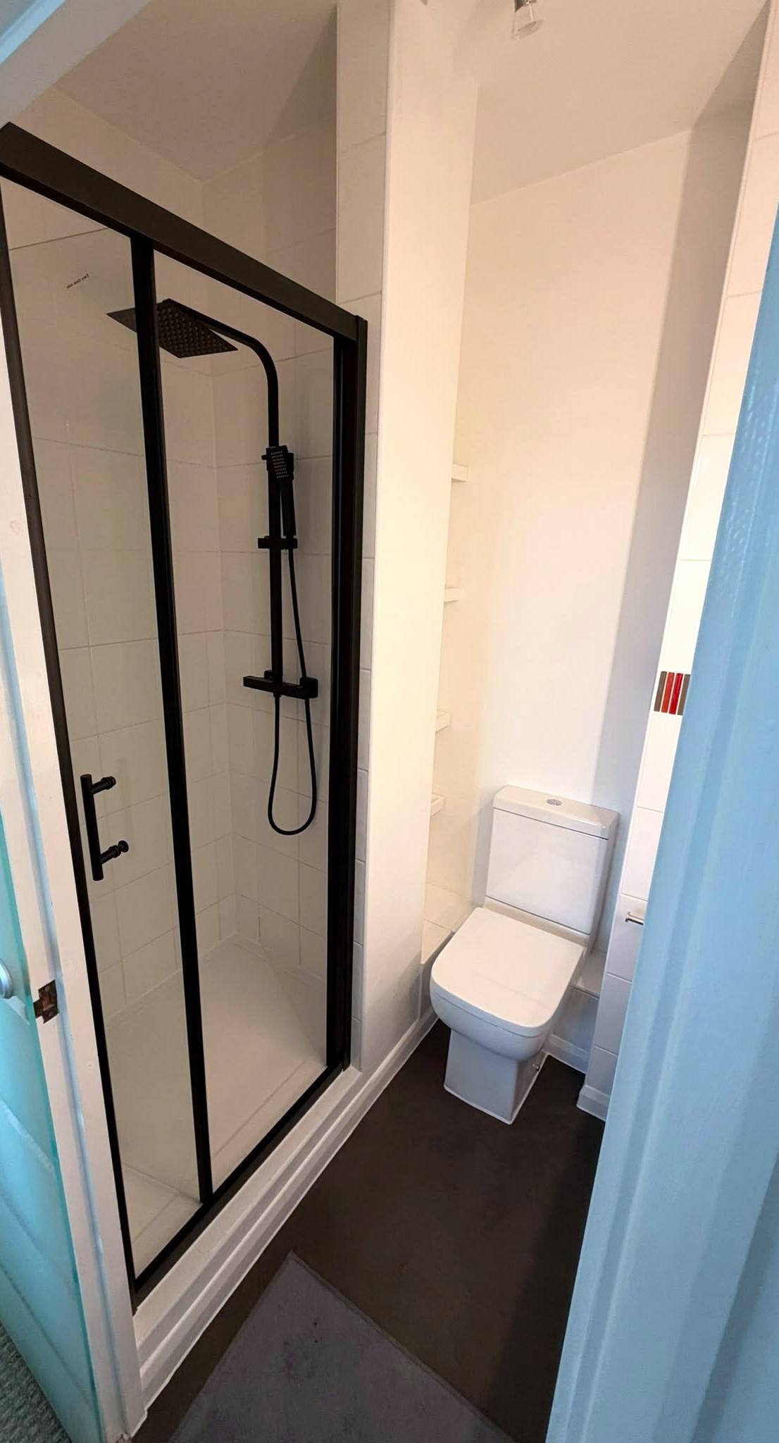 Black-framed shower enclosure with a rainfall shower