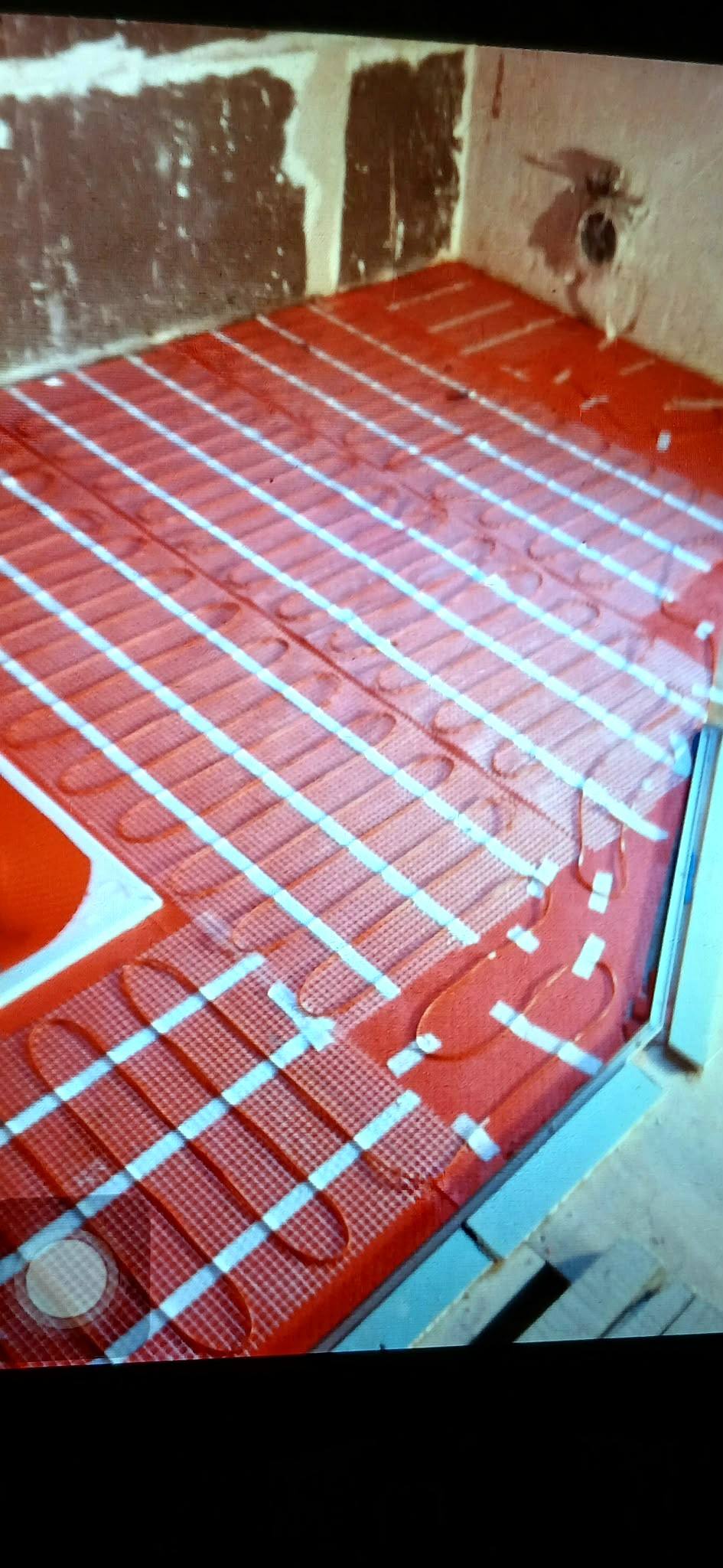 Electric underfloor heating mat laid before tiling
