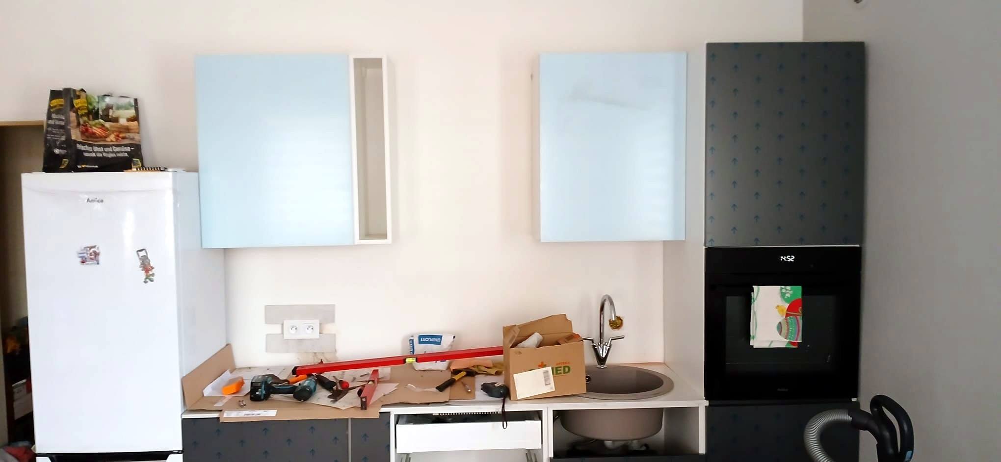 Wall units hung and base units going in