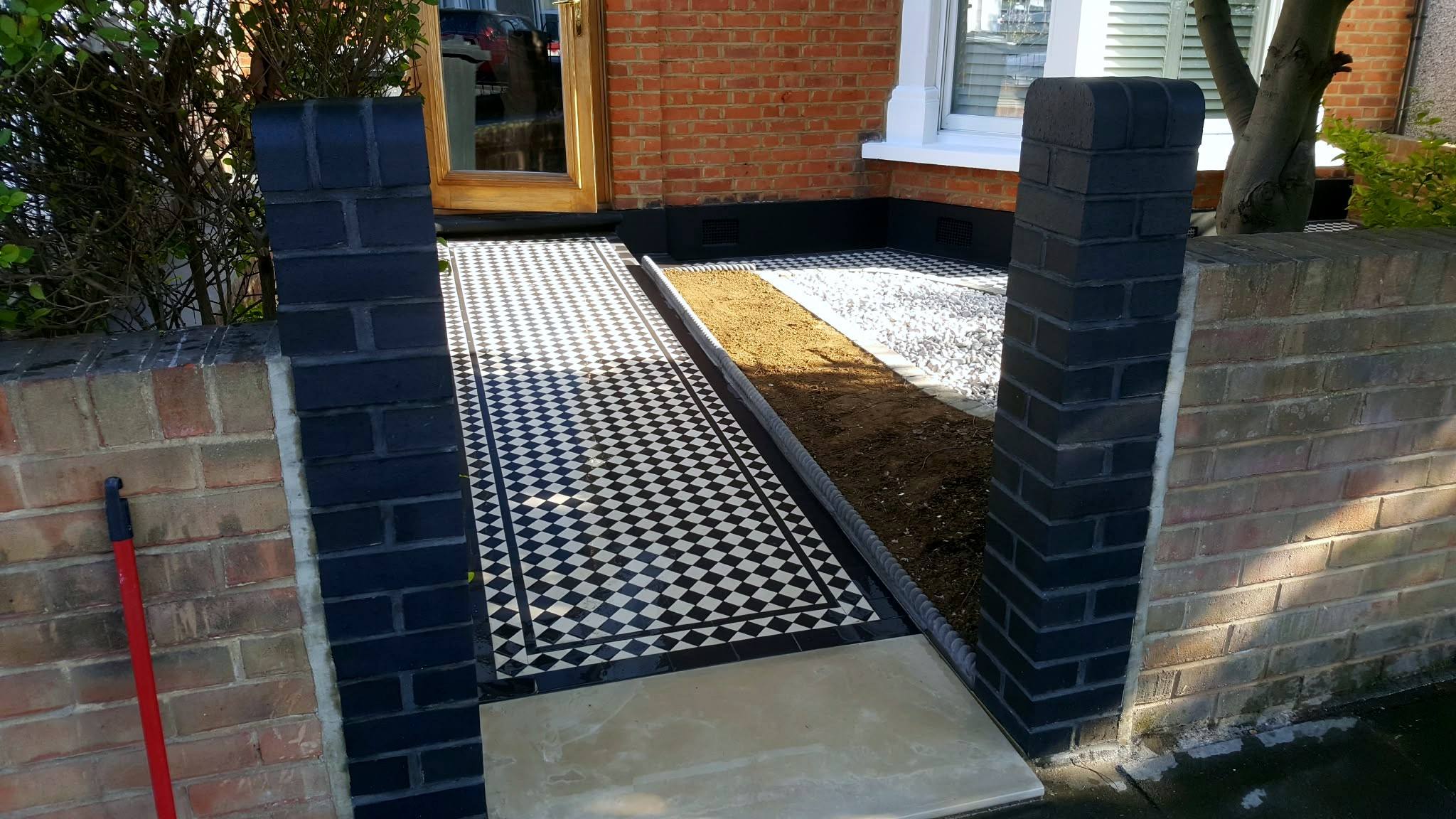 New path between brick gate pillars