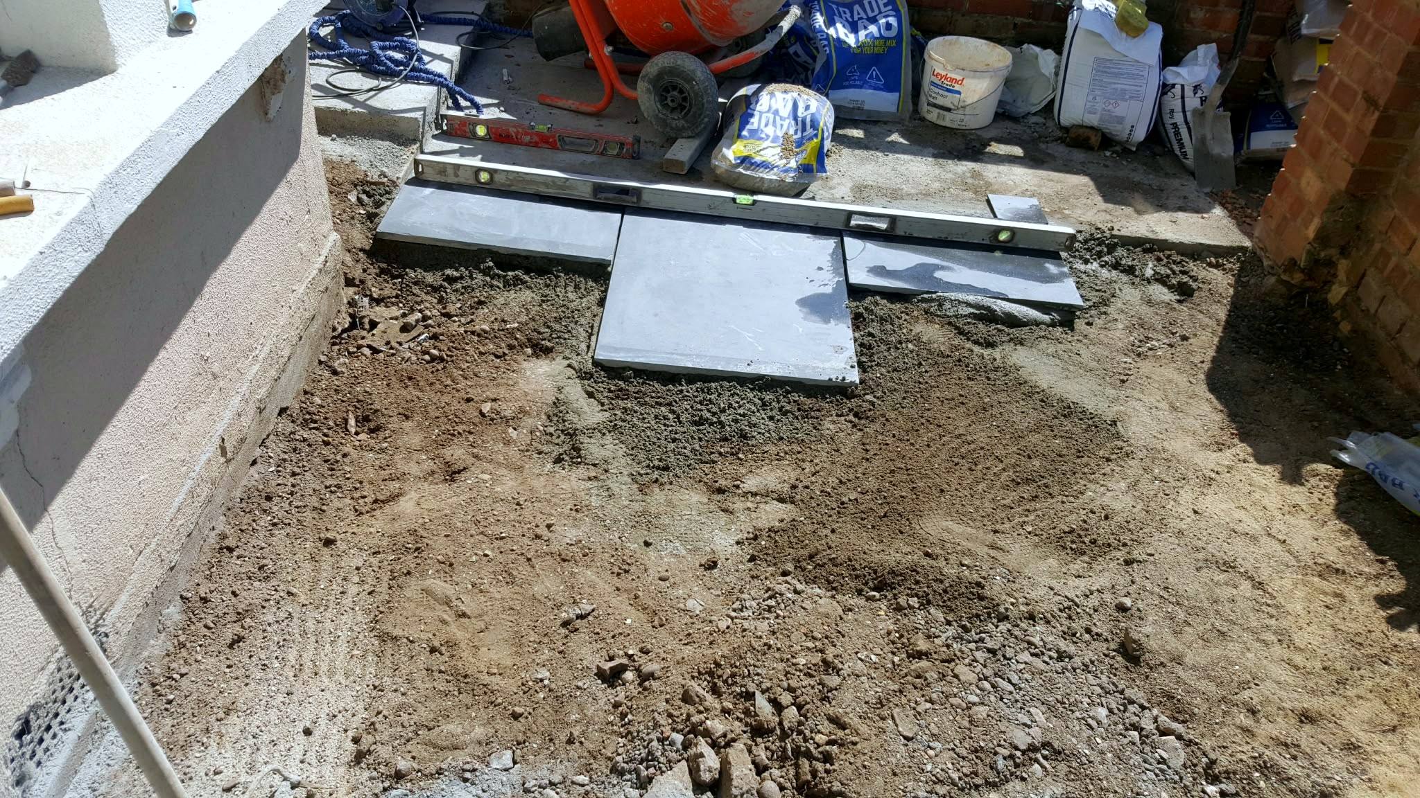 Patio groundwork and the first slabs