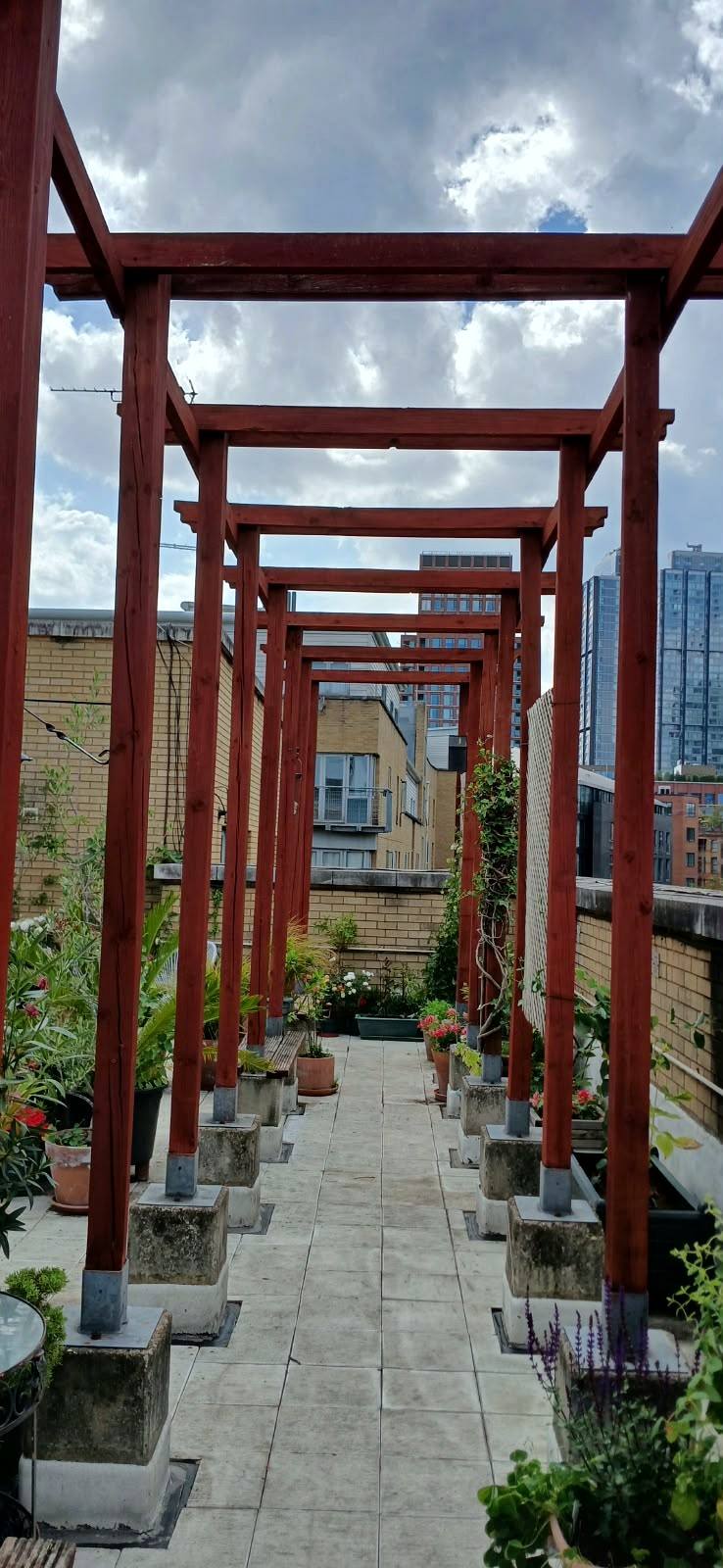Walkway under the roof terrace pergola