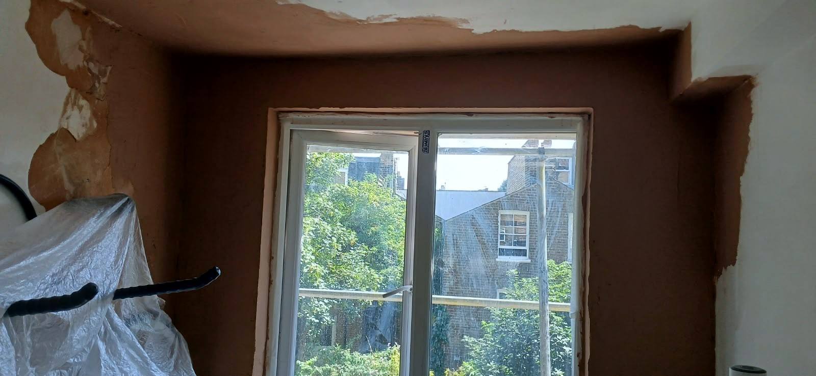 Bay window walls replastered