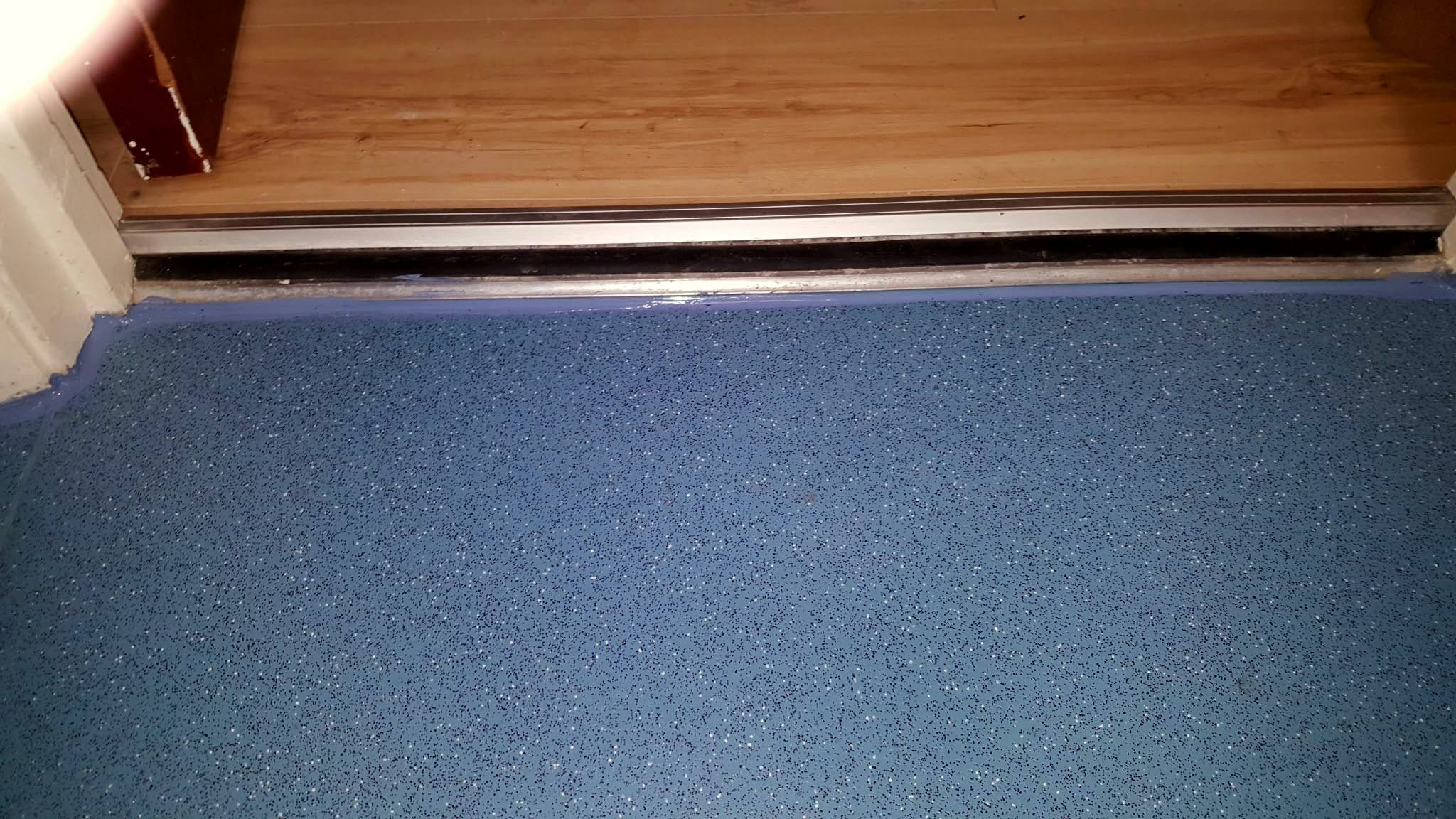 Safety flooring finished to a threshold strip